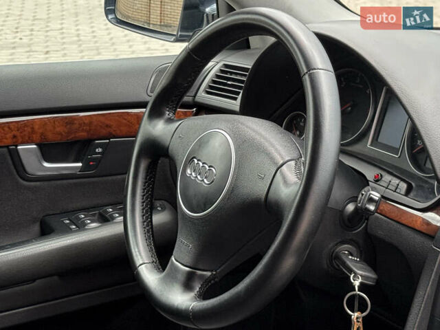 Синий Ауди А4, объемом двигателя 2.5 л и пробегом 335 тыс. км за 5950 $, фото 79 на Automoto.ua