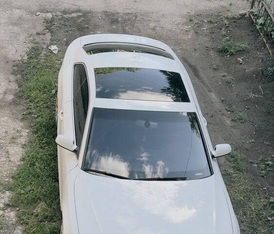 Білий Ауді A5, об'ємом двигуна 2 л та пробігом 227 тис. км за 7000 $, фото 1 на Automoto.ua