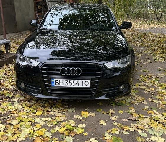 Черный Ауди А6, объемом двигателя 2 л и пробегом 230 тыс. км за 14600 $, фото 1 на Automoto.ua