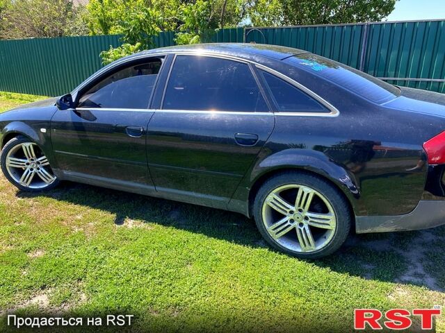 Черный Ауди А6, объемом двигателя 1.8 л и пробегом 340 тыс. км за 2600 $, фото 1 на Automoto.ua