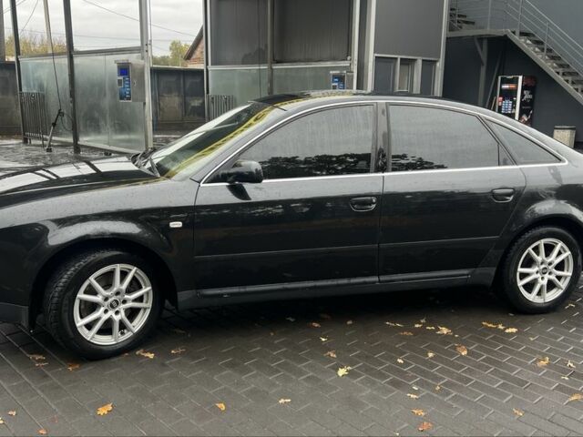 Черный Ауди А6, объемом двигателя 2.5 л и пробегом 328 тыс. км за 4100 $, фото 1 на Automoto.ua