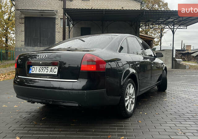 Черный Ауди А6, объемом двигателя 2.5 л и пробегом 328 тыс. км за 4100 $, фото 12 на Automoto.ua