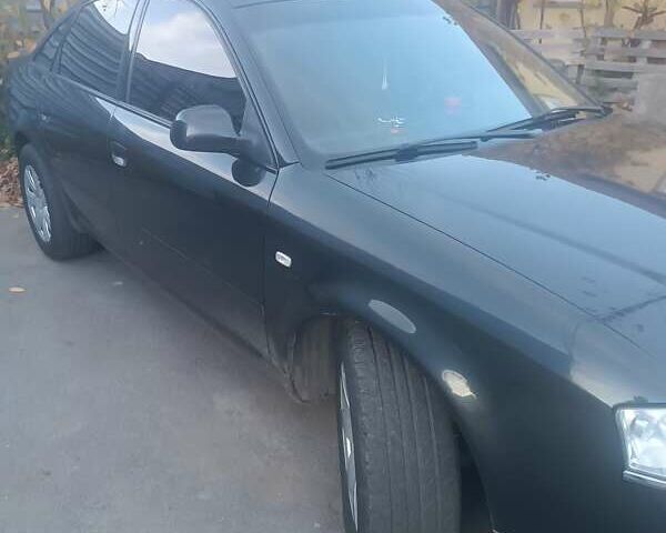 Черный Ауди А6, объемом двигателя 2.4 л и пробегом 442 тыс. км за 4800 $, фото 3 на Automoto.ua