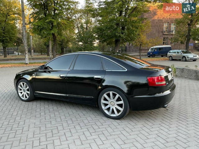 Черный Ауди А6, объемом двигателя 2.4 л и пробегом 230 тыс. км за 7000 $, фото 1 на Automoto.ua