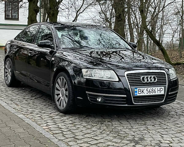 Черный Ауди А6, объемом двигателя 2 л и пробегом 248 тыс. км за 7600 $, фото 1 на Automoto.ua
