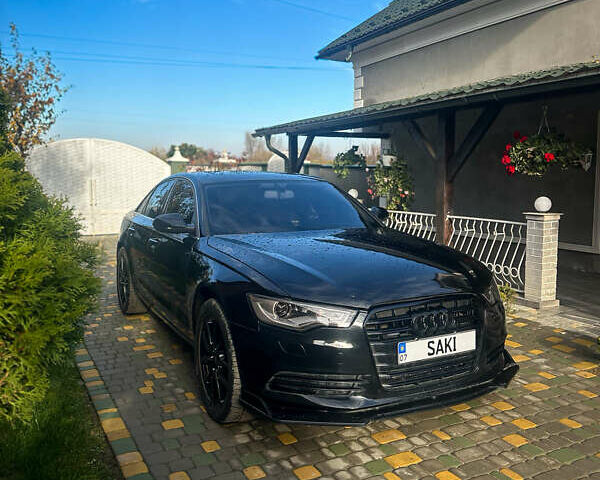 Черный Ауди А6, объемом двигателя 2 л и пробегом 265 тыс. км за 12750 $, фото 1 на Automoto.ua
