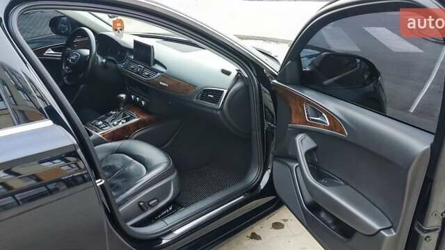 Черный Ауди А6, объемом двигателя 2 л и пробегом 231 тыс. км за 12200 $, фото 1 на Automoto.ua