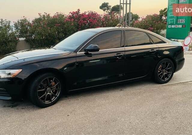 Черный Ауди А6, объемом двигателя 2 л и пробегом 165 тыс. км за 14600 $, фото 1 на Automoto.ua