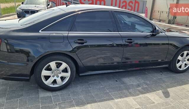 Черный Ауди А6, объемом двигателя 2 л и пробегом 260 тыс. км за 20500 $, фото 1 на Automoto.ua