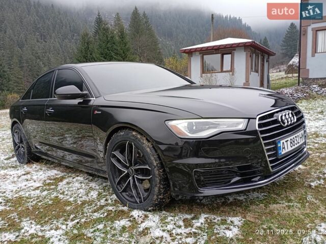 Черный Ауди А6, объемом двигателя 2 л и пробегом 300 тыс. км за 15200 $, фото 1 на Automoto.ua