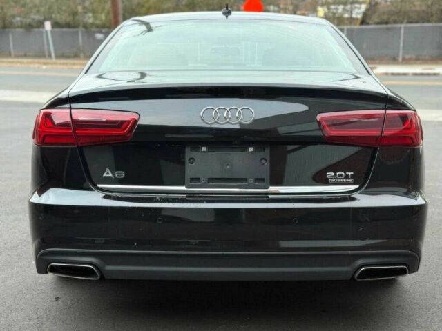 Черный Ауди А6, объемом двигателя 2 л и пробегом 43 тыс. км за 6600 $, фото 4 на Automoto.ua