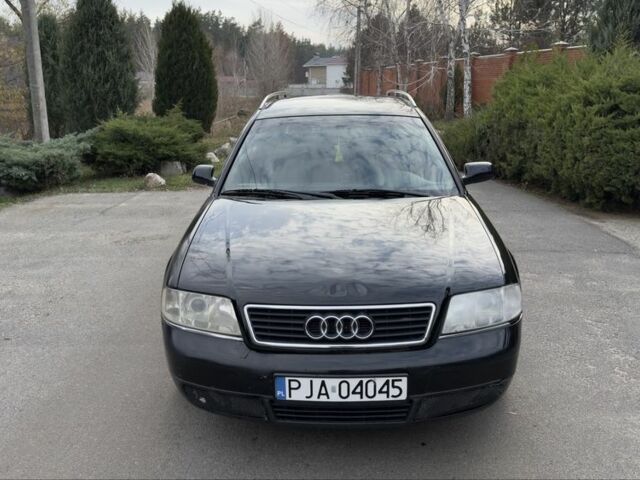 Черный Ауди А6, объемом двигателя 1.8 л и пробегом 300 тыс. км за 1750 $, фото 1 на Automoto.ua