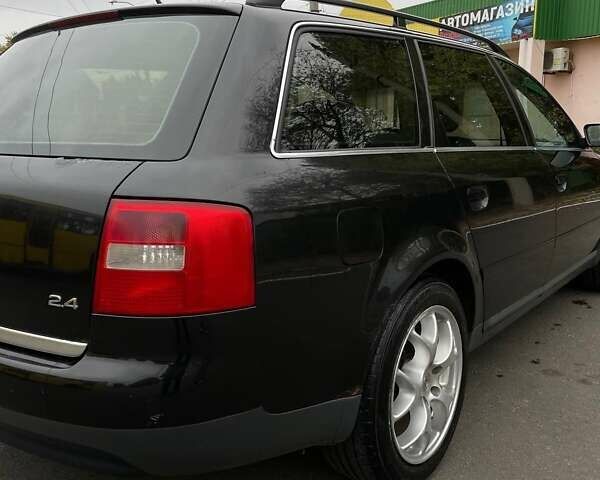 Черный Ауди А6, объемом двигателя 2.4 л и пробегом 335 тыс. км за 3800 $, фото 1 на Automoto.ua