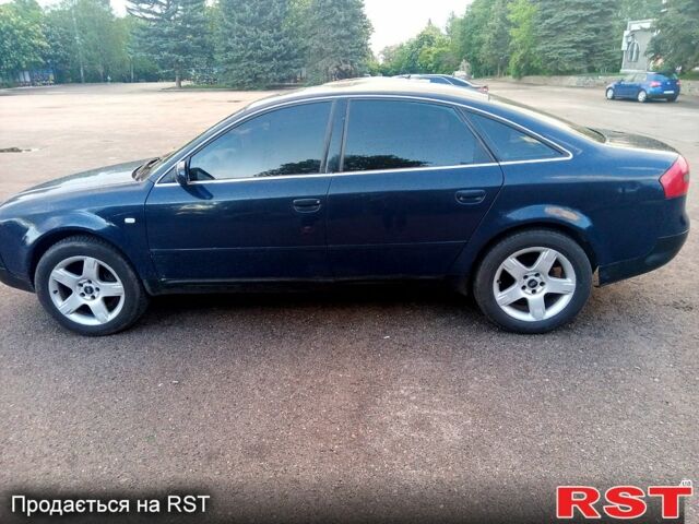 Синий Ауди А6, объемом двигателя 2.4 л и пробегом 300 тыс. км за 2600 $, фото 1 на Automoto.ua