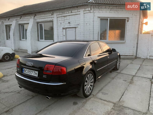 Черный Ауди А8, объемом двигателя 3.7 л и пробегом 330 тыс. км за 6500 $, фото 1 на Automoto.ua