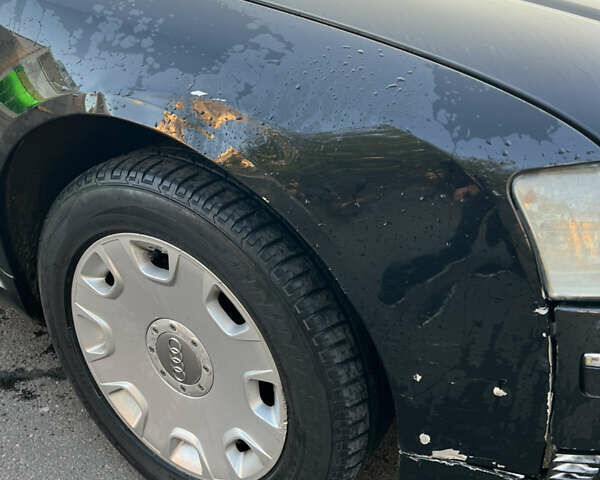 Черный Ауди А8, объемом двигателя 2.98 л и пробегом 336 тыс. км за 6000 $, фото 2 на Automoto.ua