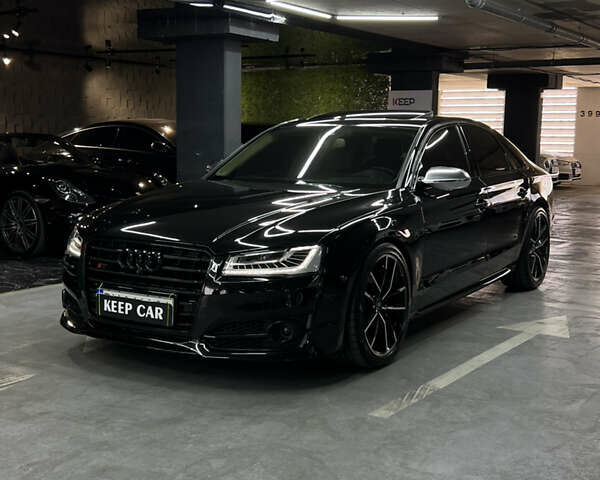 Черный Ауди С8, объемом двигателя 4 л и пробегом 205 тыс. км за 34000 $, фото 1 на Automoto.ua