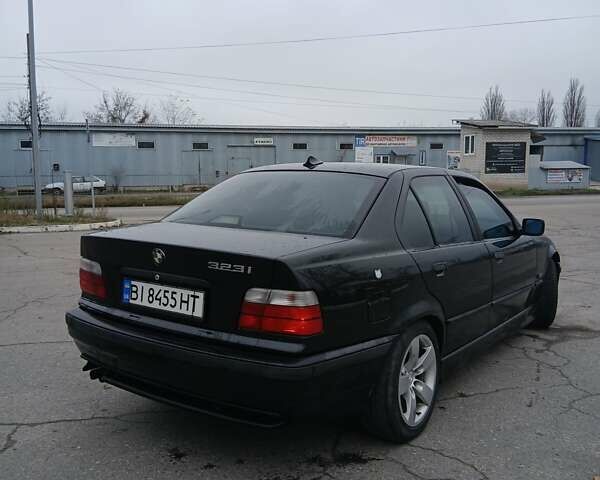 Черный БМВ 3 Серия, объемом двигателя 2.8 л и пробегом 450 тыс. км за 2799 $, фото 3 на Automoto.ua