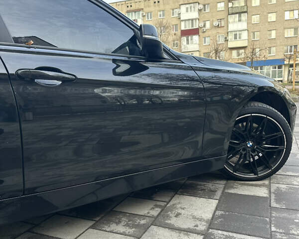 Чорний БМВ 3 Серія, об'ємом двигуна 2 л та пробігом 173 тис. км за 13450 $, фото 17 на Automoto.ua