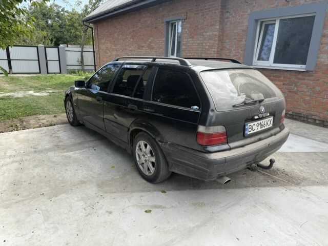 Черный БМВ 3 Серия, объемом двигателя 1.6 л и пробегом 465 тыс. км за 1550 $, фото 3 на Automoto.ua