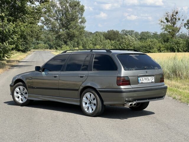 Серый БМВ 3 Серия, объемом двигателя 2.5 л и пробегом 365 тыс. км за 4000 $, фото 1 на Automoto.ua