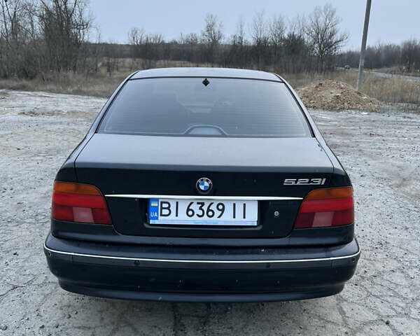 Черный БМВ 5 Серия, объемом двигателя 2.5 л и пробегом 470 тыс. км за 4100 $, фото 1 на Automoto.ua