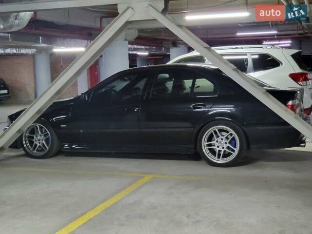 Черный БМВ 5 Серия, объемом двигателя 4.4 л и пробегом 650 тыс. км за 7000 $, фото 1 на Automoto.ua