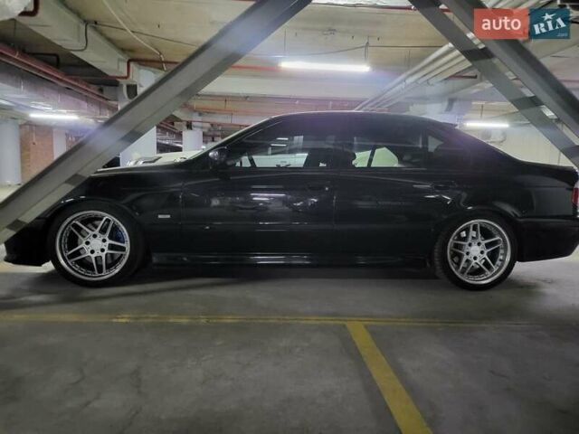 Черный БМВ 5 Серия, объемом двигателя 4.4 л и пробегом 650 тыс. км за 7000 $, фото 6 на Automoto.ua