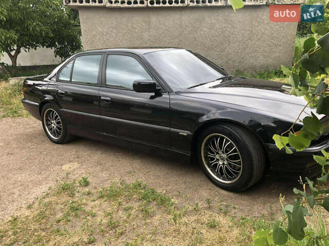 Черный БМВ 7 Серия, объемом двигателя 4.4 л и пробегом 447 тыс. км за 7500 $, фото 6 на Automoto.ua