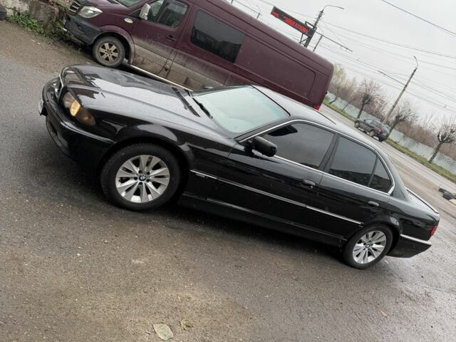 Черный БМВ 7 Серия, объемом двигателя 4.4 л и пробегом 380 тыс. км за 1999 $, фото 1 на Automoto.ua