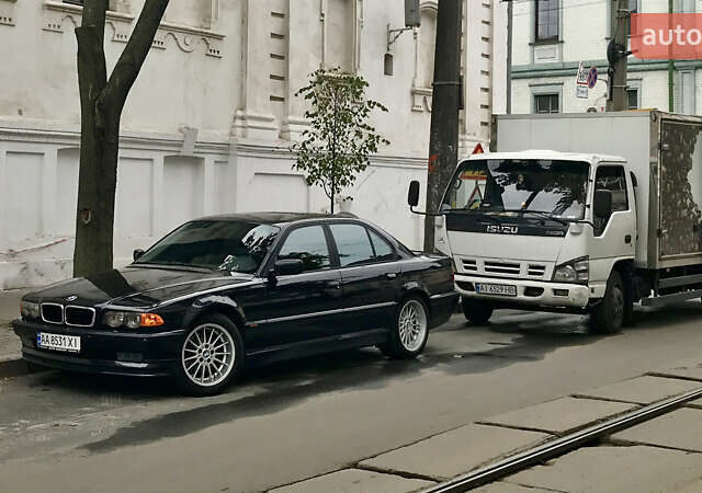 Черный БМВ 7 Серия, объемом двигателя 3.5 л и пробегом 370 тыс. км за 12000 $, фото 1 на Automoto.ua
