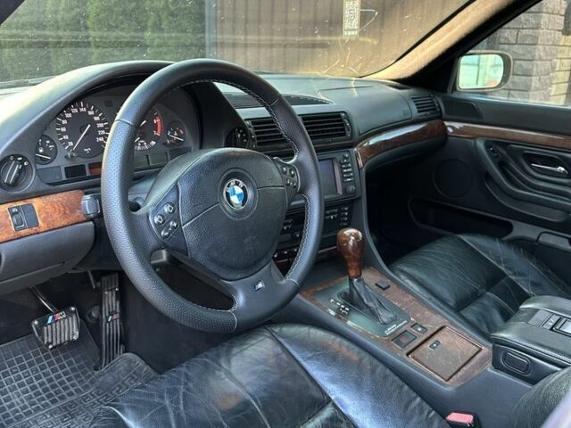 Черный БМВ 7 Серия, объемом двигателя 4.4 л и пробегом 300 тыс. км за 4950 $, фото 4 на Automoto.ua