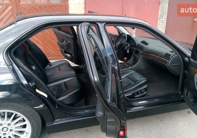Черный БМВ 7 Серия, объемом двигателя 3.5 л и пробегом 370 тыс. км за 12000 $, фото 3 на Automoto.ua