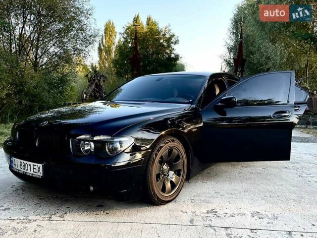 Черный БМВ 7 Серия, объемом двигателя 4.4 л и пробегом 500 тыс. км за 12000 $, фото 1 на Automoto.ua