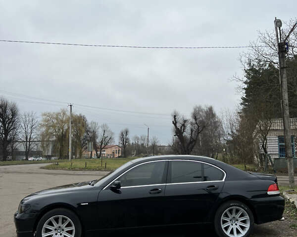 Черный БМВ 7 Серия, объемом двигателя 4.4 л и пробегом 358 тыс. км за 4599 $, фото 4 на Automoto.ua