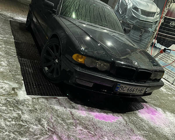 Черный БМВ 7 Серия, объемом двигателя 4.4 л и пробегом 380 тыс. км за 5000 $, фото 1 на Automoto.ua