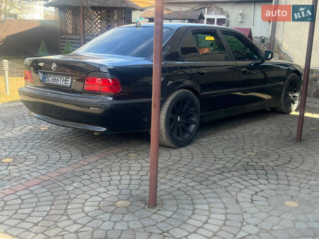 Черный БМВ 7 Серия, объемом двигателя 4.4 л и пробегом 380 тыс. км за 5000 $, фото 6 на Automoto.ua