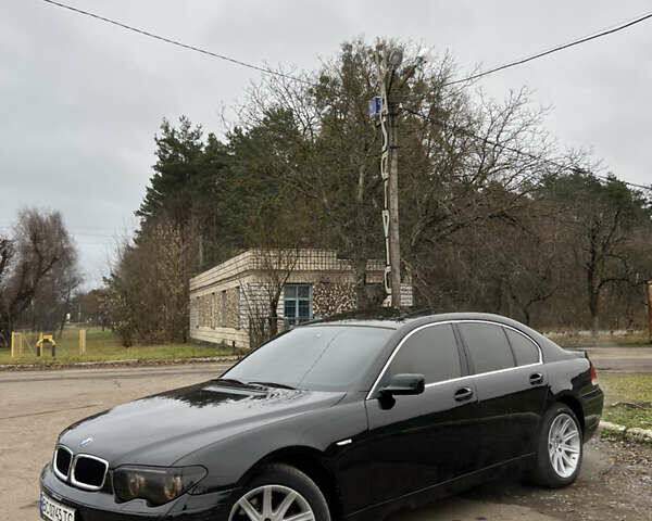 Черный БМВ 7 Серия, объемом двигателя 4.4 л и пробегом 358 тыс. км за 4599 $, фото 1 на Automoto.ua