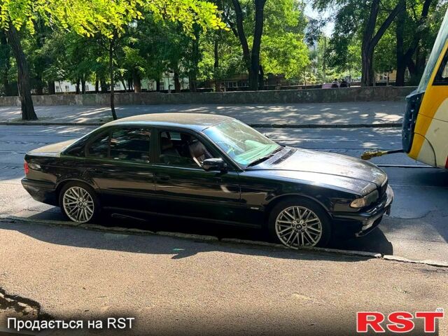 Чорний БМВ 7 Серія, об'ємом двигуна 4.4 л та пробігом 400 тис. км за 8300 $, фото 1 на Automoto.ua