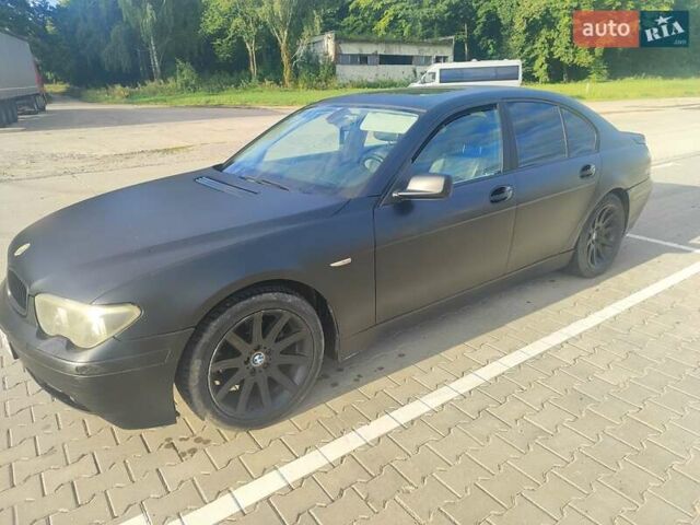 Черный БМВ 7 Серия, объемом двигателя 2.99 л и пробегом 372 тыс. км за 8000 $, фото 1 на Automoto.ua