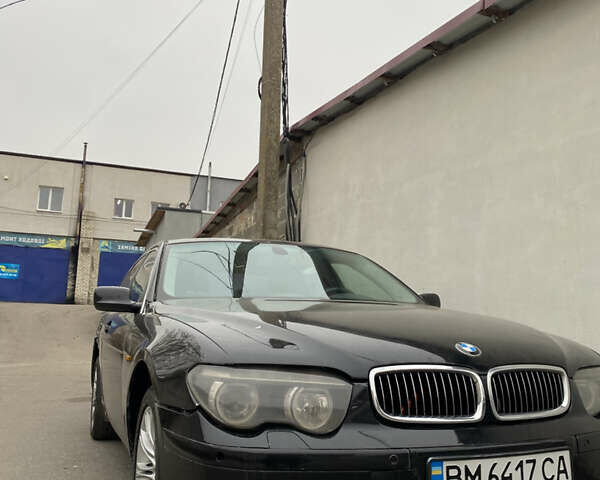 Черный БМВ 7 Серия, объемом двигателя 4.4 л и пробегом 400 тыс. км за 3600 $, фото 1 на Automoto.ua
