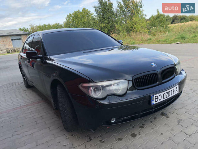 Черный БМВ 7 Серия, объемом двигателя 4.4 л и пробегом 465 тыс. км за 4450 $, фото 1 на Automoto.ua