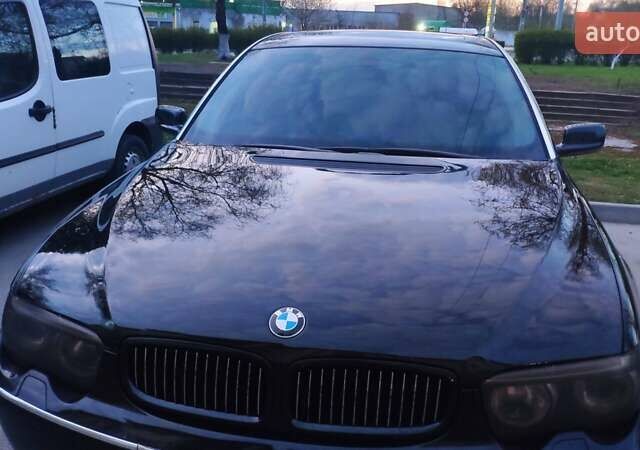 Черный БМВ 7 Серия, объемом двигателя 4.4 л и пробегом 430 тыс. км за 5600 $, фото 1 на Automoto.ua