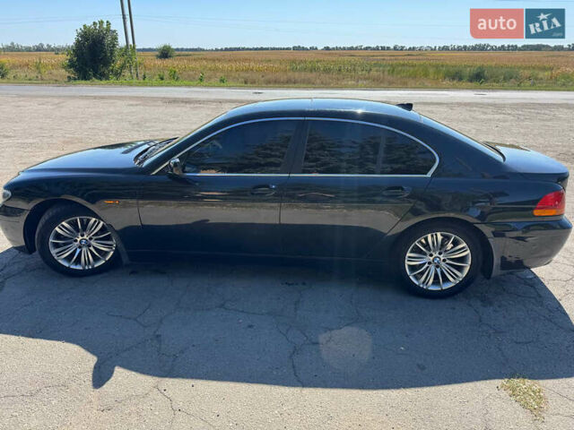 Чорний БМВ 7 Серія, об'ємом двигуна 4.4 л та пробігом 462 тис. км за 5100 $, фото 1 на Automoto.ua