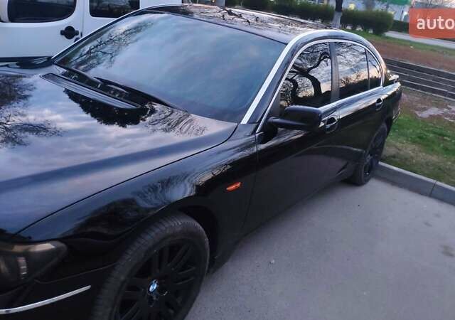 Черный БМВ 7 Серия, объемом двигателя 4.4 л и пробегом 430 тыс. км за 5600 $, фото 2 на Automoto.ua