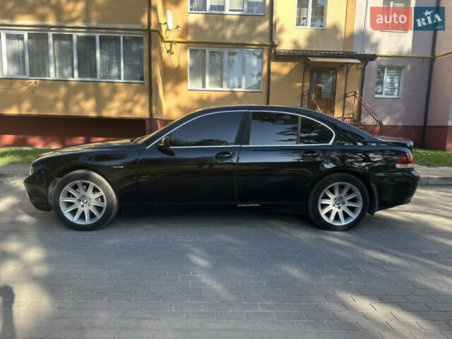 Черный БМВ 7 Серия, объемом двигателя 2.99 л и пробегом 338 тыс. км за 5950 $, фото 1 на Automoto.ua