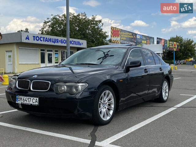 Черный БМВ 7 Серия, объемом двигателя 4.4 л и пробегом 285 тыс. км за 3800 $, фото 1 на Automoto.ua