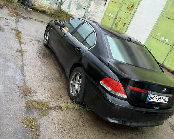 Черный БМВ 7 Серия, объемом двигателя 3.6 л и пробегом 242 тыс. км за 2999 $, фото 3 на Automoto.ua