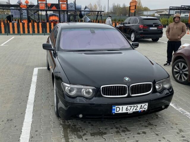 Черный БМВ 7 Серия, объемом двигателя 4.8 л и пробегом 310 тыс. км за 5500 $, фото 1 на Automoto.ua