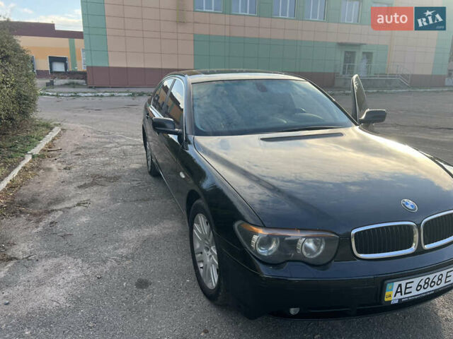 Черный БМВ 7 Серия, объемом двигателя 4.4 л и пробегом 350 тыс. км за 7500 $, фото 1 на Automoto.ua